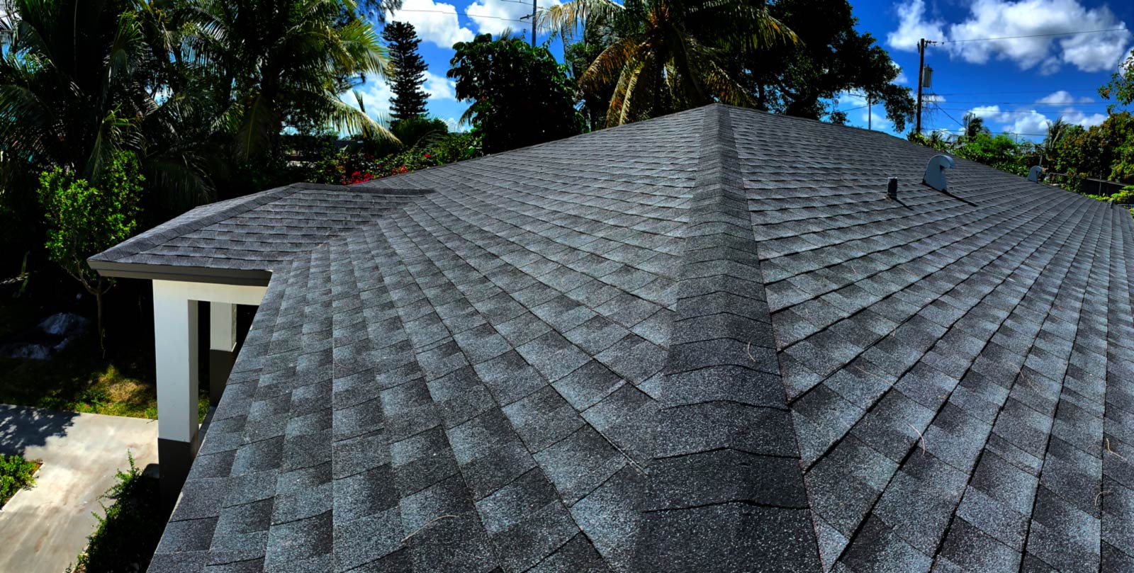 Panoramic photo of dark dimensional shingle roof