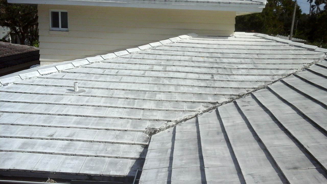Before photo of previous roof at rear valley.